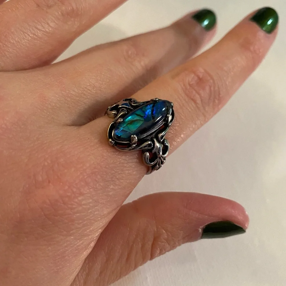 Silver Tone Costume Jewelry Ring with Blue Swirl Jewel Design